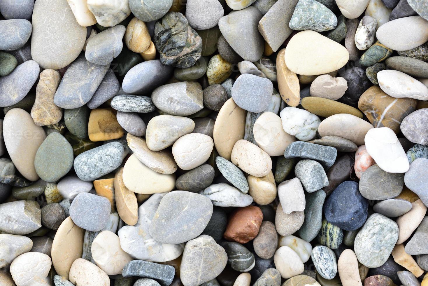 Background and texture of pebbles lying next to each other photo