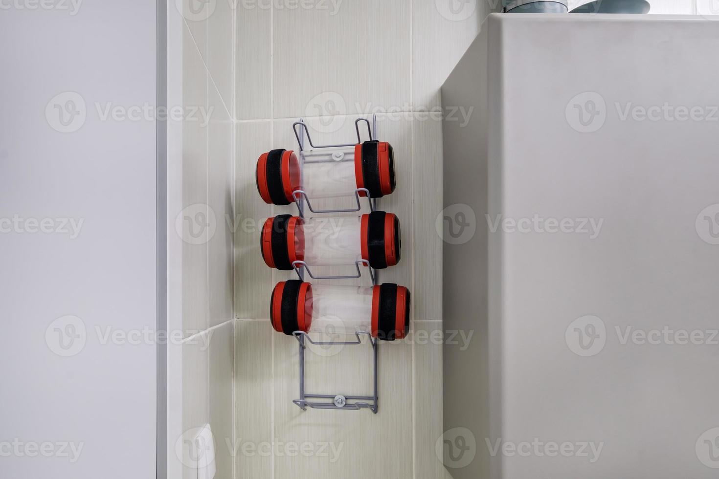 rows of empty pneumatic tubes of transfer system station in modern clinic, designed for fast operational transfer of analyzes, drugs and documents through air tunnels photo