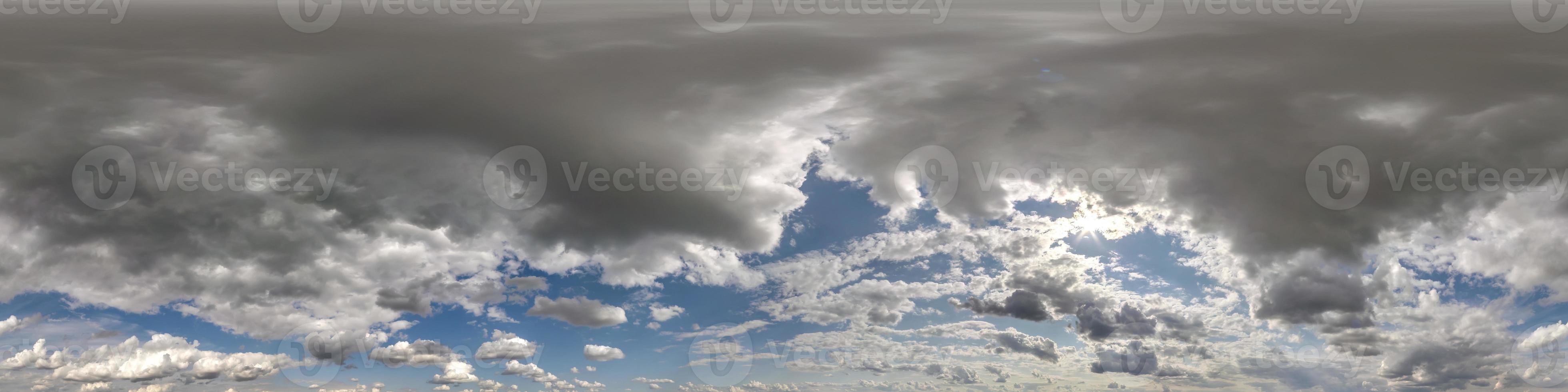 blue sky with dark beautiful clouds before storm. Seamless hdri panorama 360 degrees angle view  with zenith for use in 3d graphics or game development as sky dome or edit drone shot photo