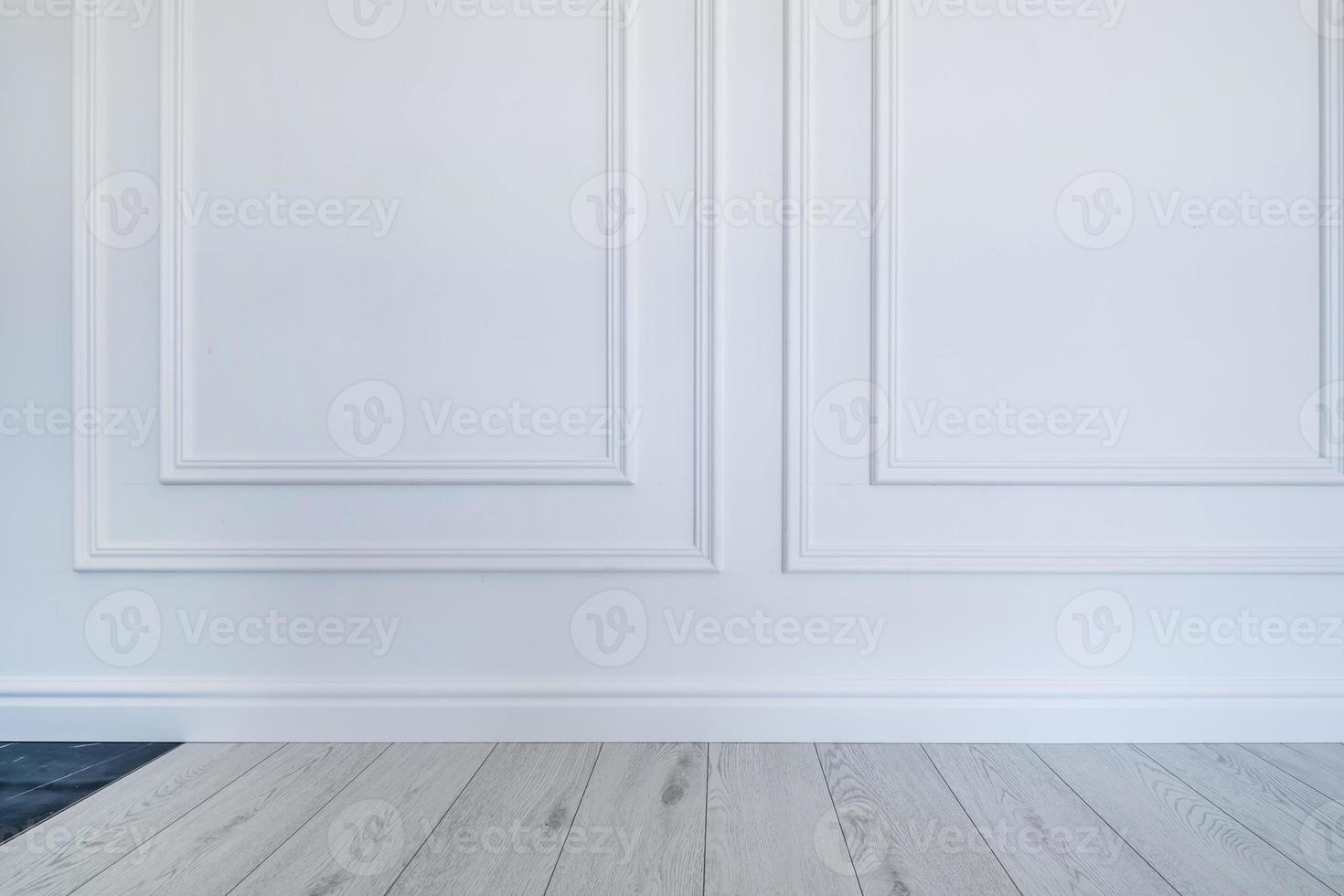 Detail of corner flooring with intricate crown molding and plinth. photo