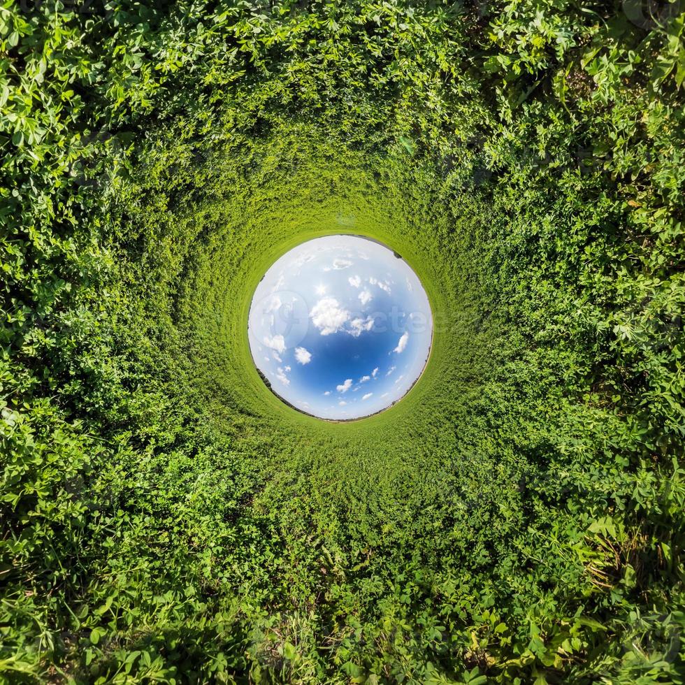 Blue little planet. Inversion of tiny planet transformation of spherical panorama 360 degrees. Spherical abstract aerial view. Curvature of space. photo