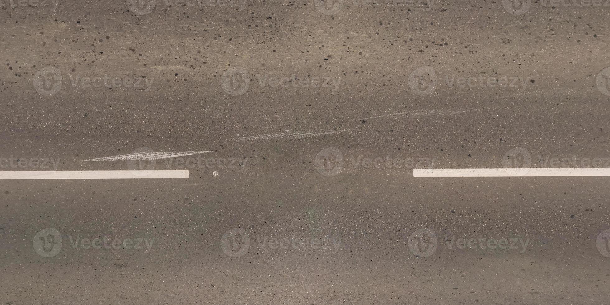 view from above on texture of old asphalt road photo