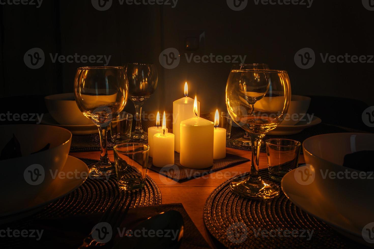 served table with cutlery and candles in interior of modern luxure guest room in studio apartments.  intimate atmosphere photo