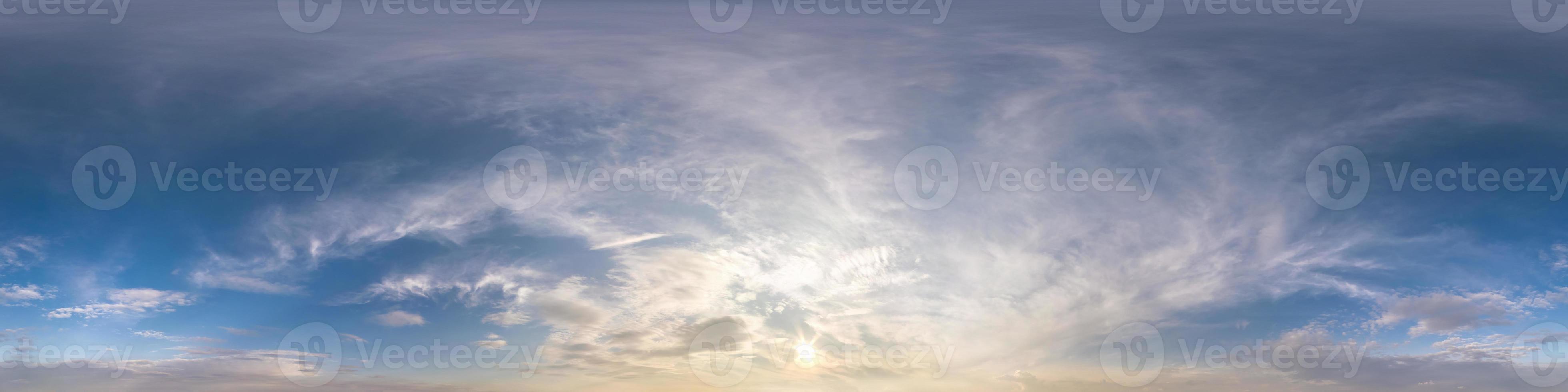 hdri 360 panorama of sunset sky with white beautiful clouds in seamless projection with zenith for use in 3d graphics or game development as sky dome or edit drone shot for sky replacement photo