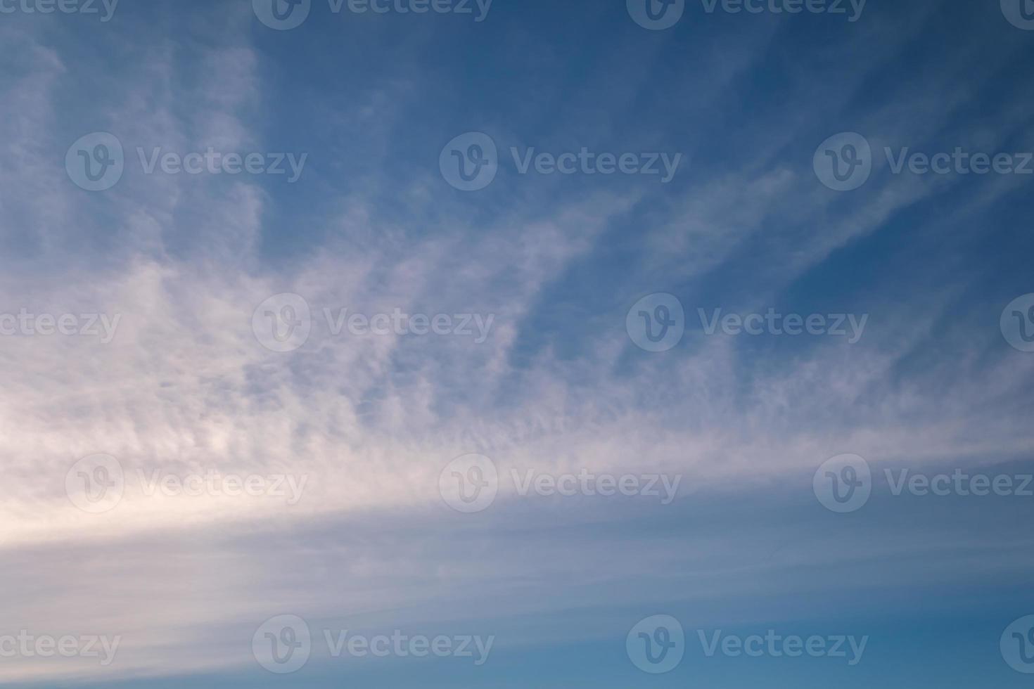 Blue sky background with white striped clouds. blue sky panorama may use for sky replacement photo