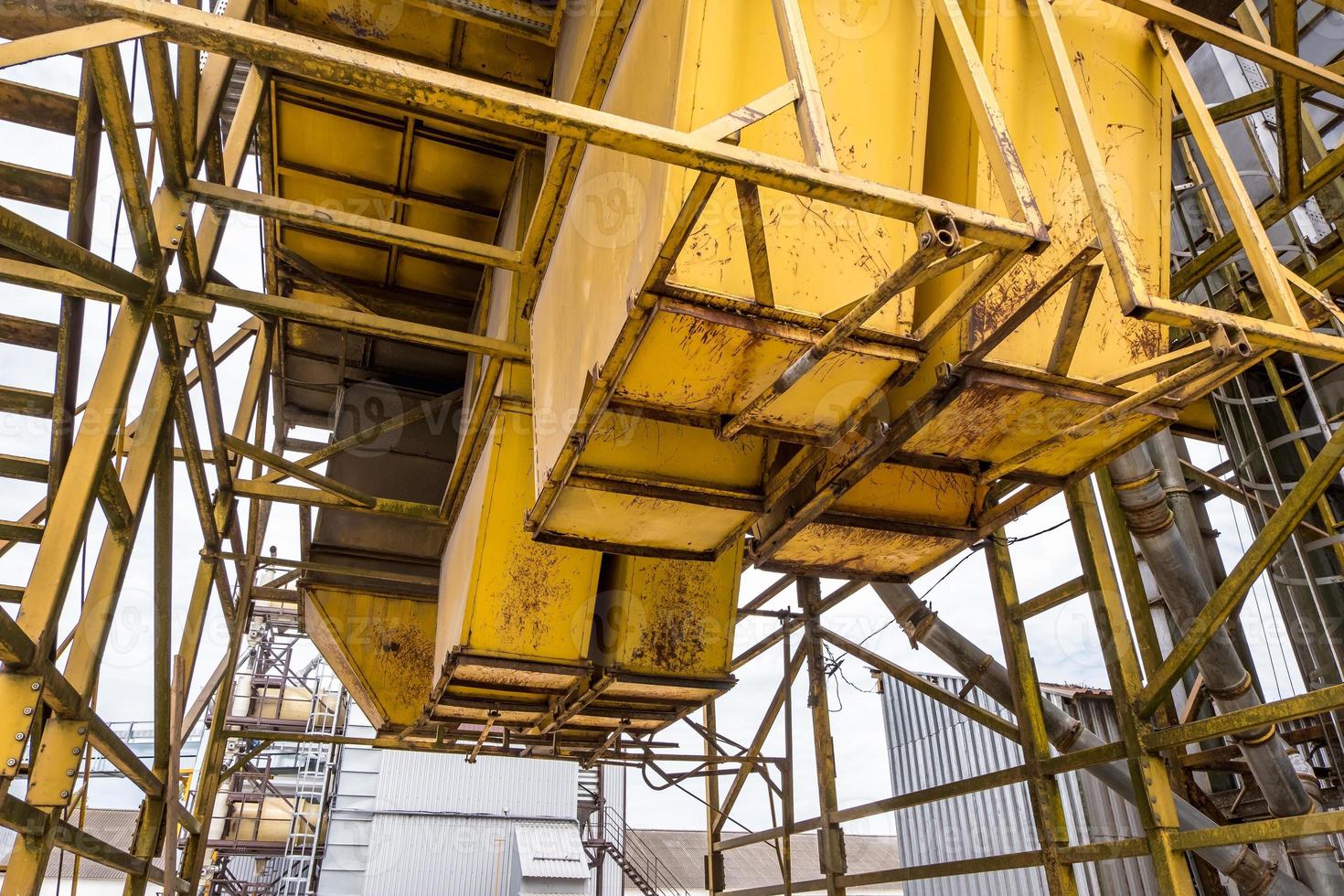 Modern Granary elevator. Silver silos on agro-processing and manufacturing plant for processing drying cleaning and storage of agricultural products, flour, cereals and grain. photo