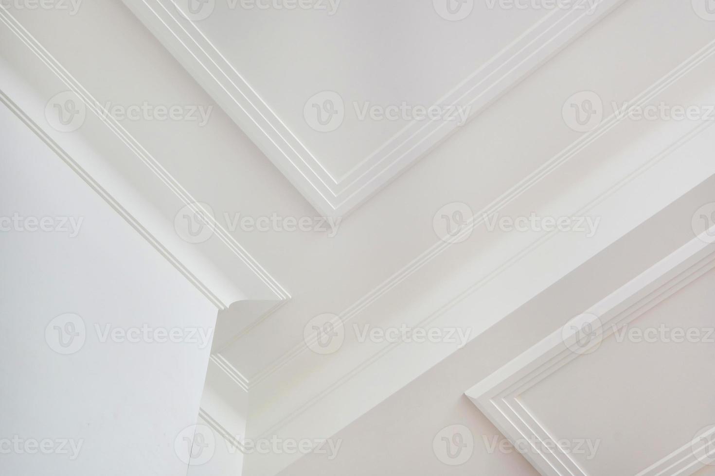 Detail of corner ceiling cornice with intricate crown molding. photo