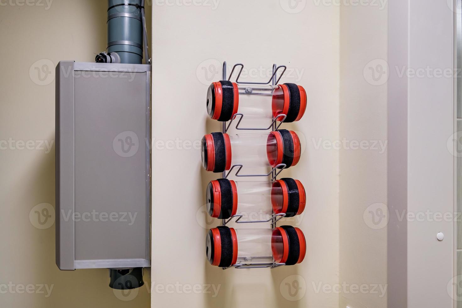 rows of empty pneumatic tubes of transfer system station in modern clinic, designed for fast operational transfer of analyzes, drugs and documents through air tunnels photo