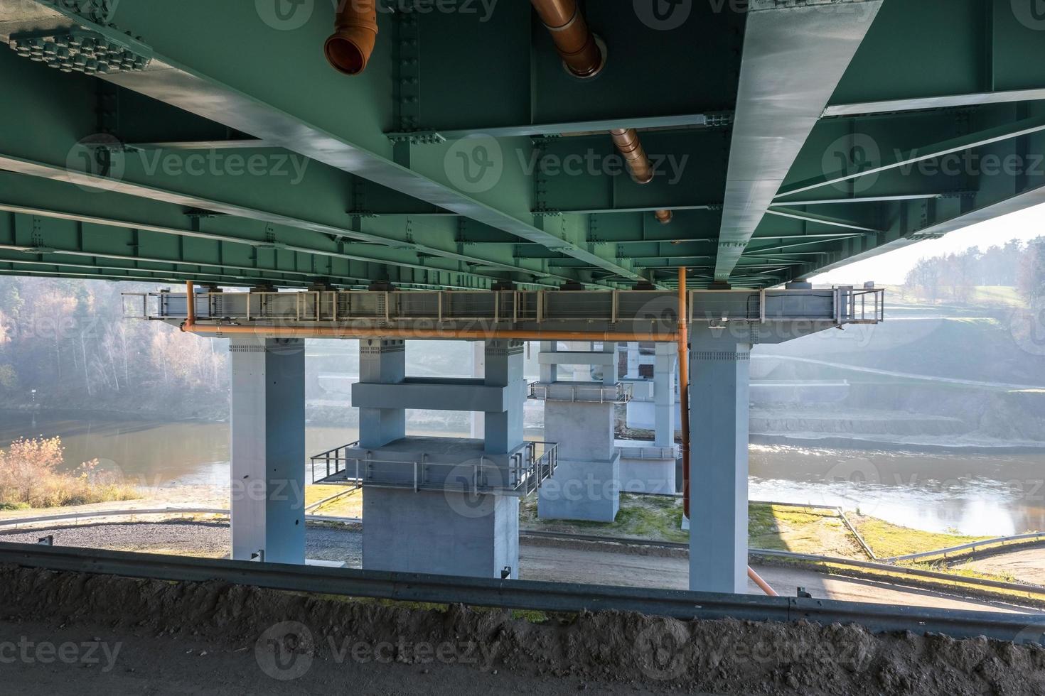 huge car bridge across the wide river photo