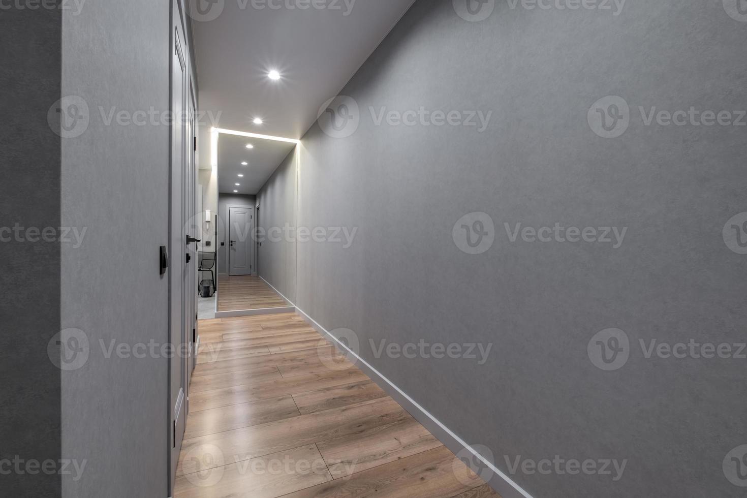 long empty corridor in interior of entrance hall of modern apartments, office or clinic photo