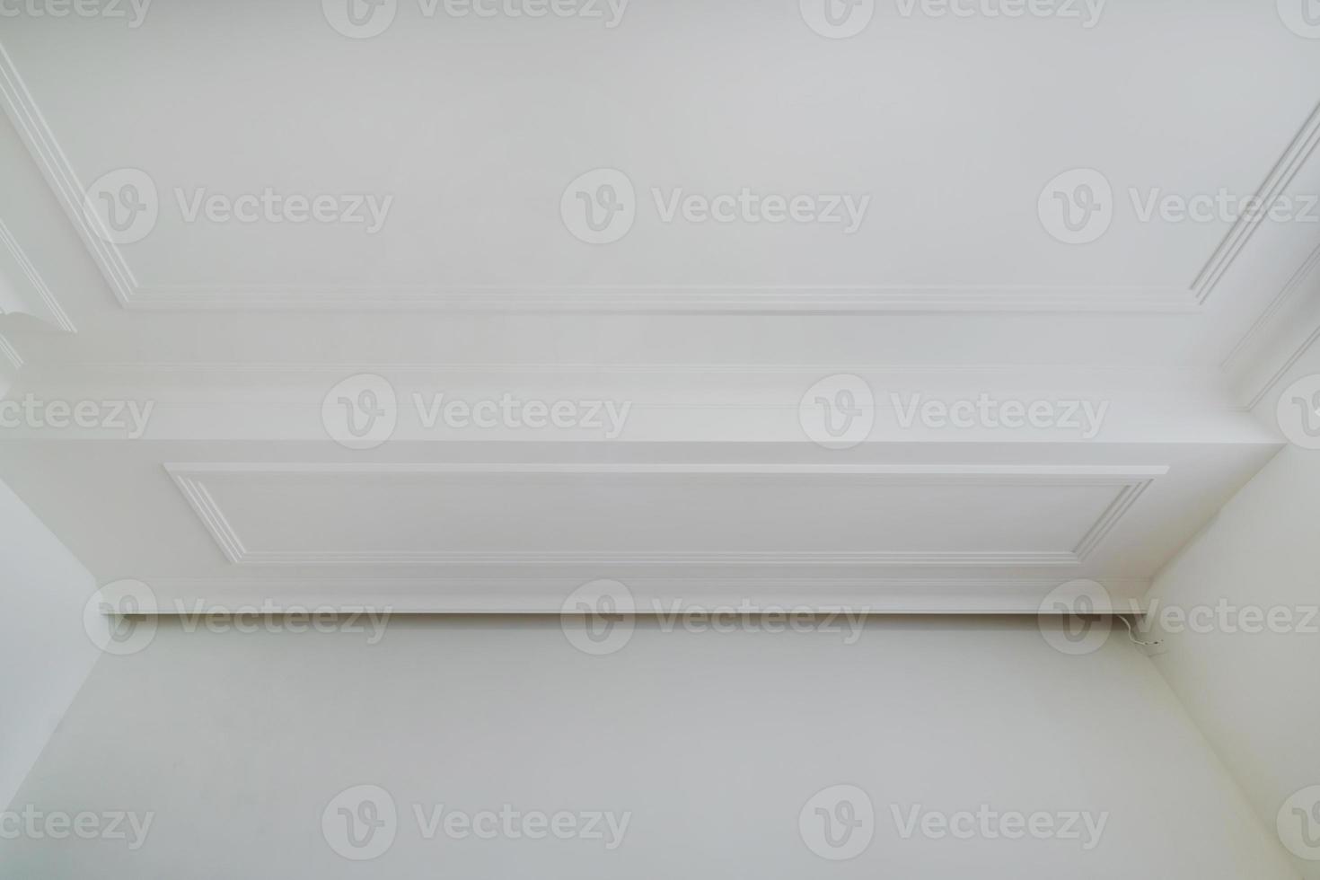 Detail of corner ceiling cornice with intricate crown molding. photo
