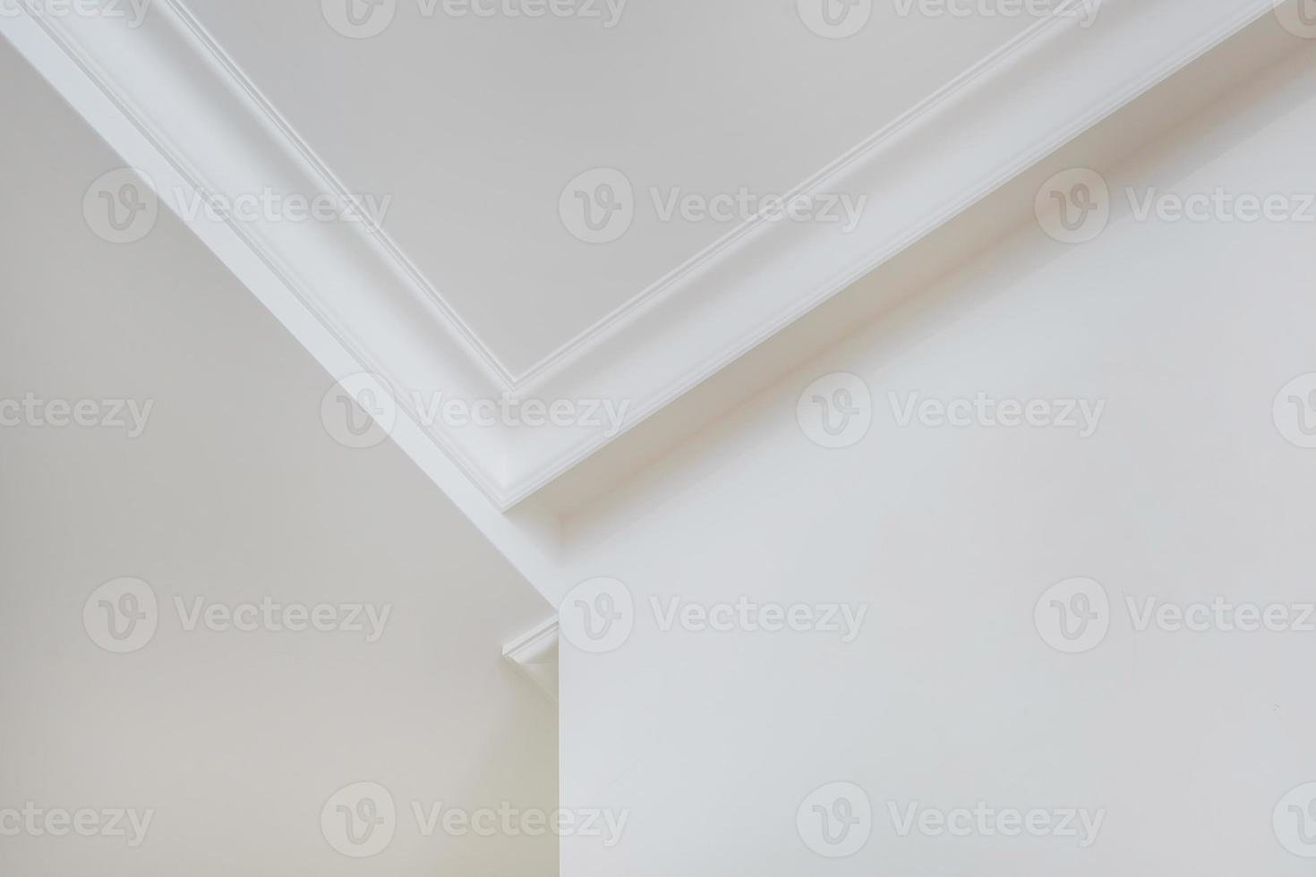 Detail of corner ceiling cornice with intricate crown molding. photo