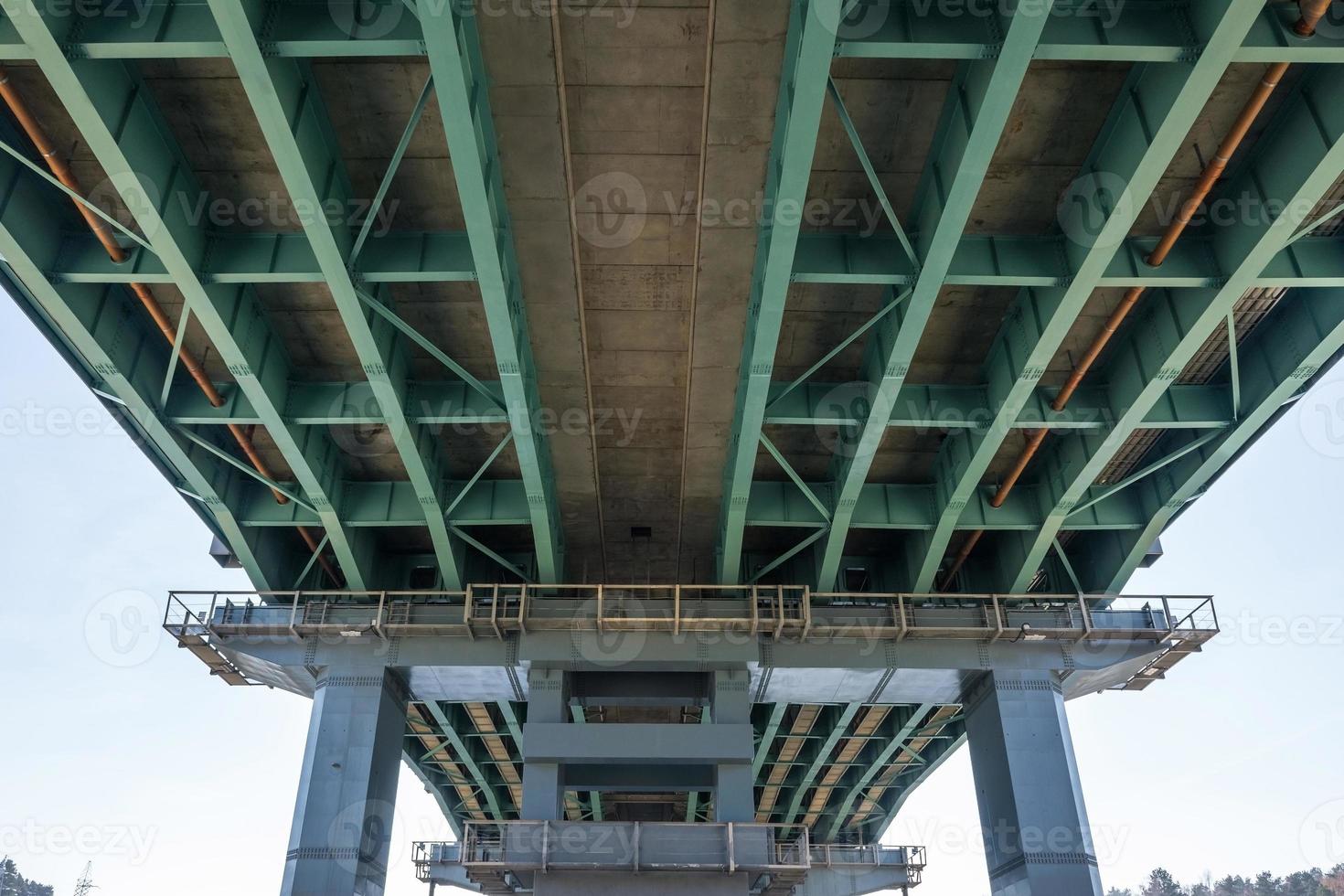 huge car bridge across the wide river photo