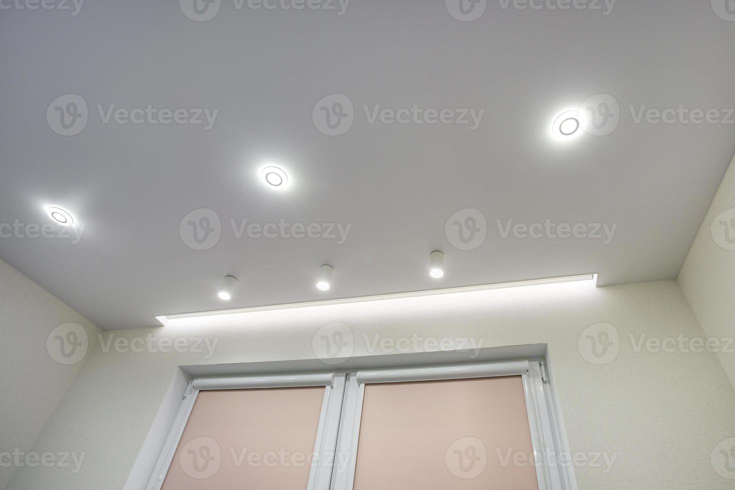 suspended ceiling with halogen spots lamps and drywall construction in ...