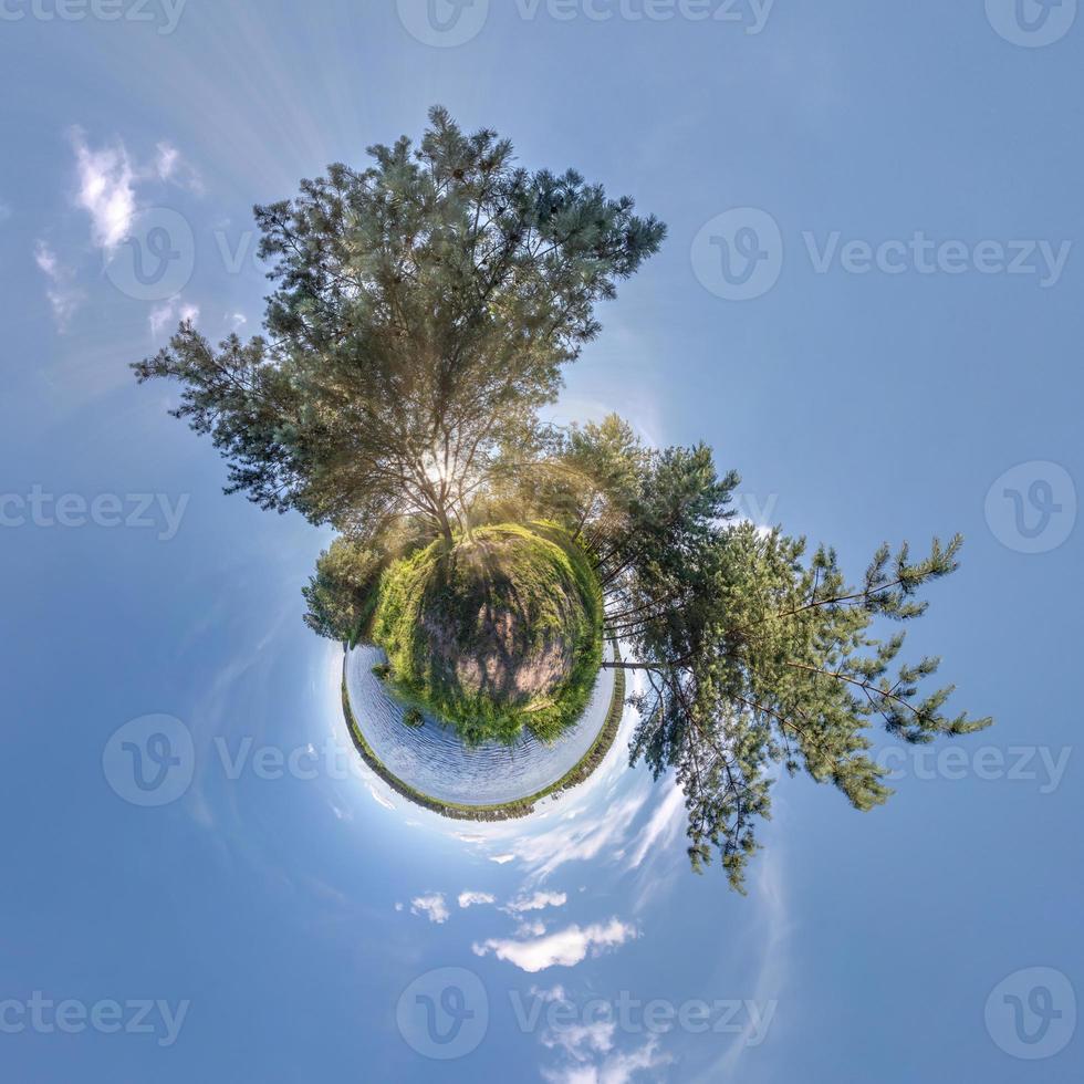 green tiny planet transformation of spherical panorama 360 degrees. Spherical abstract aerial view on forest. Curvature of space. photo