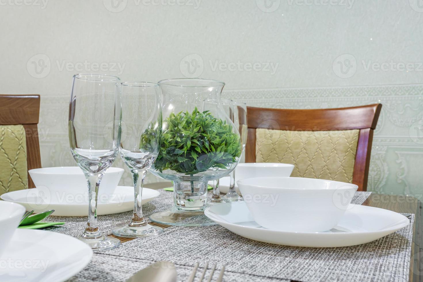 served table with a bouquet of roses in interior of modern luxure guest room in studio apartments in minimalistic style photo