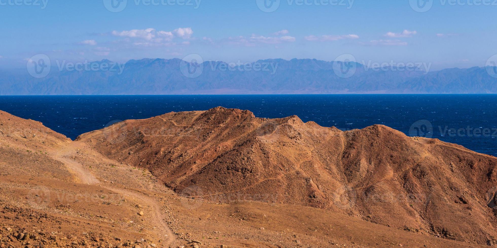 panorama view from the height of the mountains range  to the blue sea photo