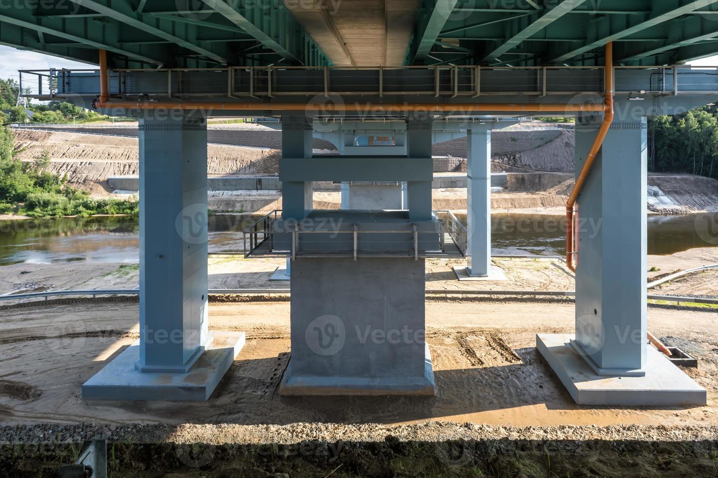 car bridge across the wide river photo