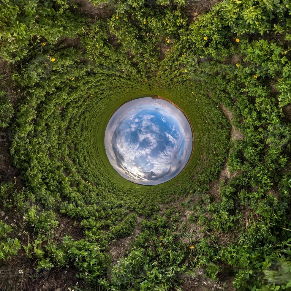 Blue little planet. Inversion of tiny planet transformation of spherical panorama 360 degrees. Spherical abstract aerial view. Curvature of space. photo