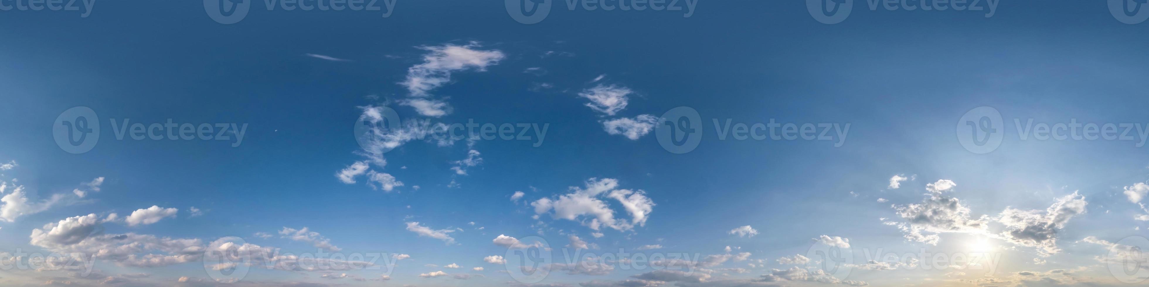 clear blue sky hdri 360 panorama with white clouds. Seamless panorama with zenith for use in 3d graphics or game development as sky dome or edit drone shot for sky replacement photo
