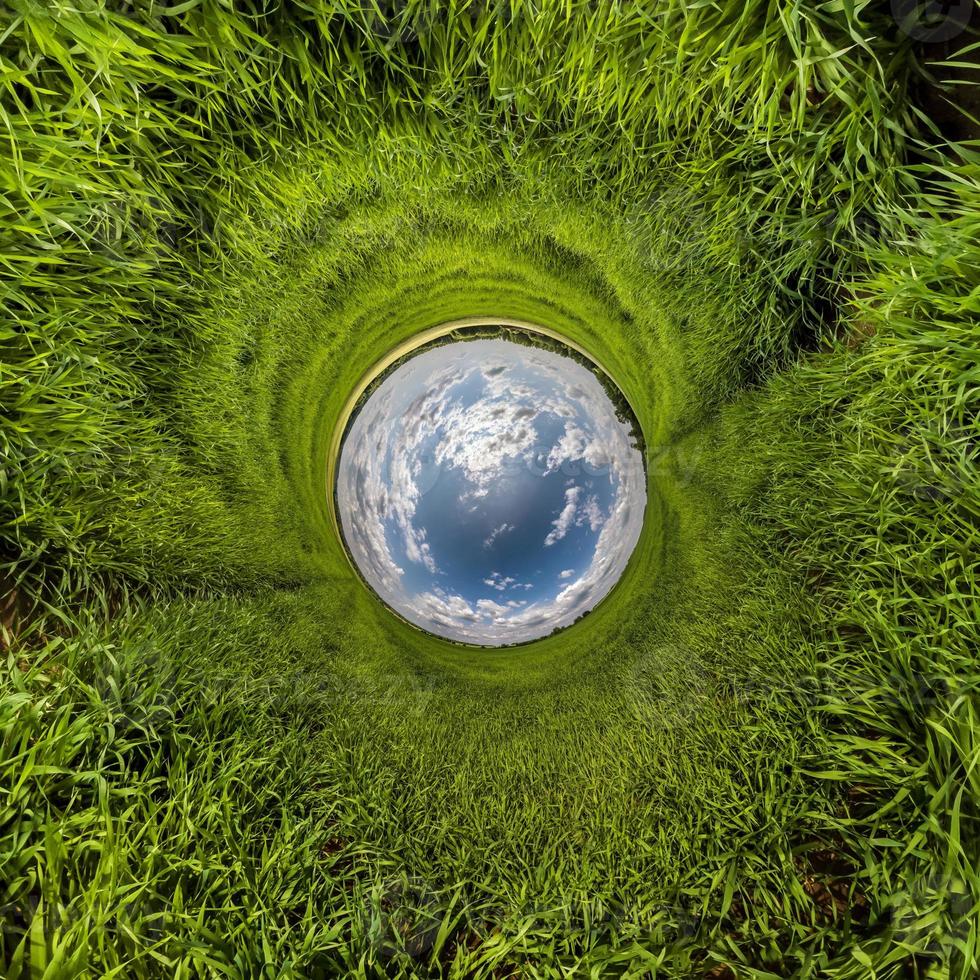 Blue little planet. Inversion of tiny planet transformation of spherical panorama 360 degrees. Spherical abstract aerial view. Curvature of space. photo