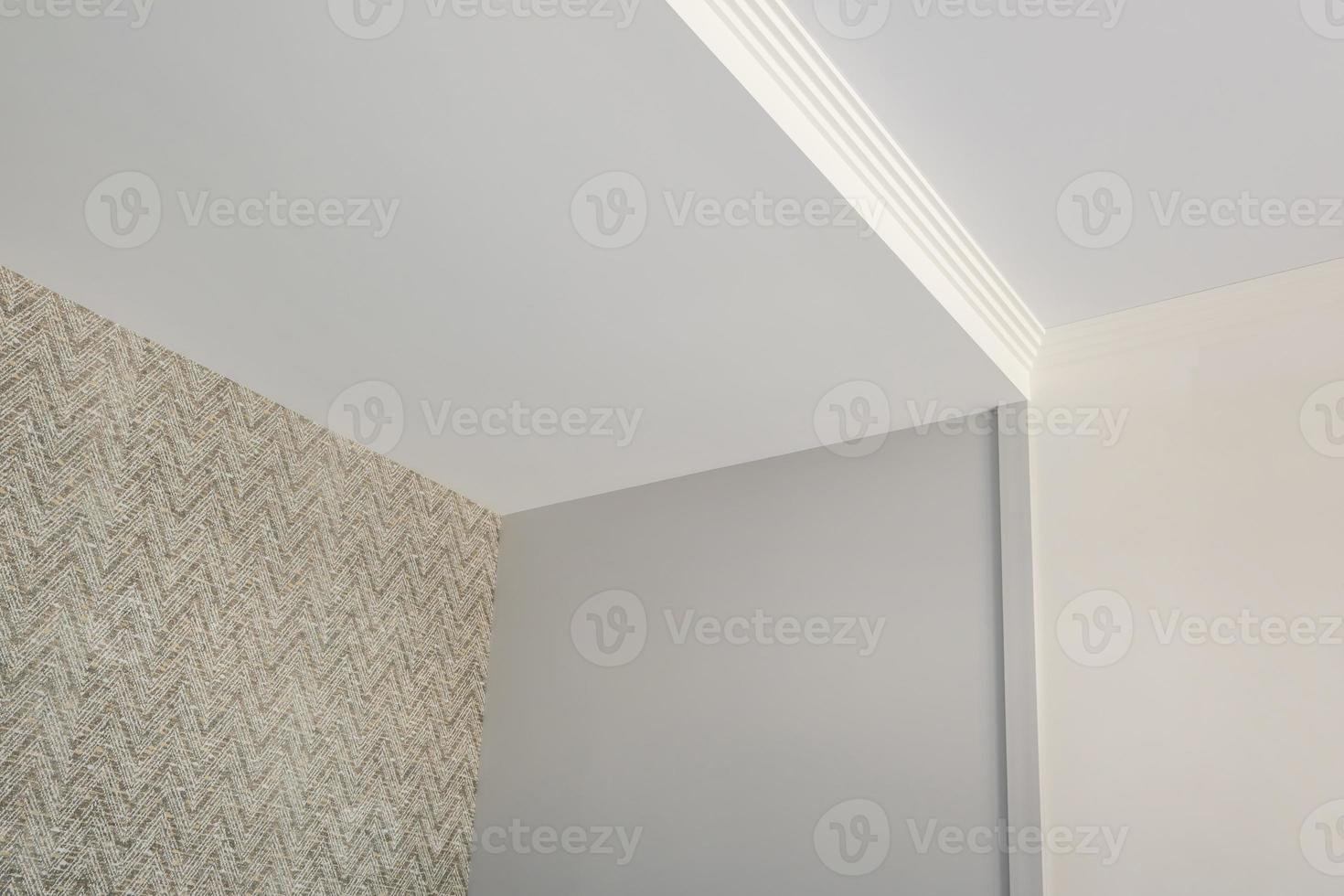 Detail of corner ceiling cornice with intricate crown molding. photo