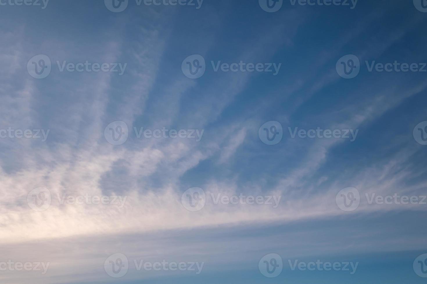 Blue sky background with big white striped clouds. blue sky panorama may use for sky replacement photo