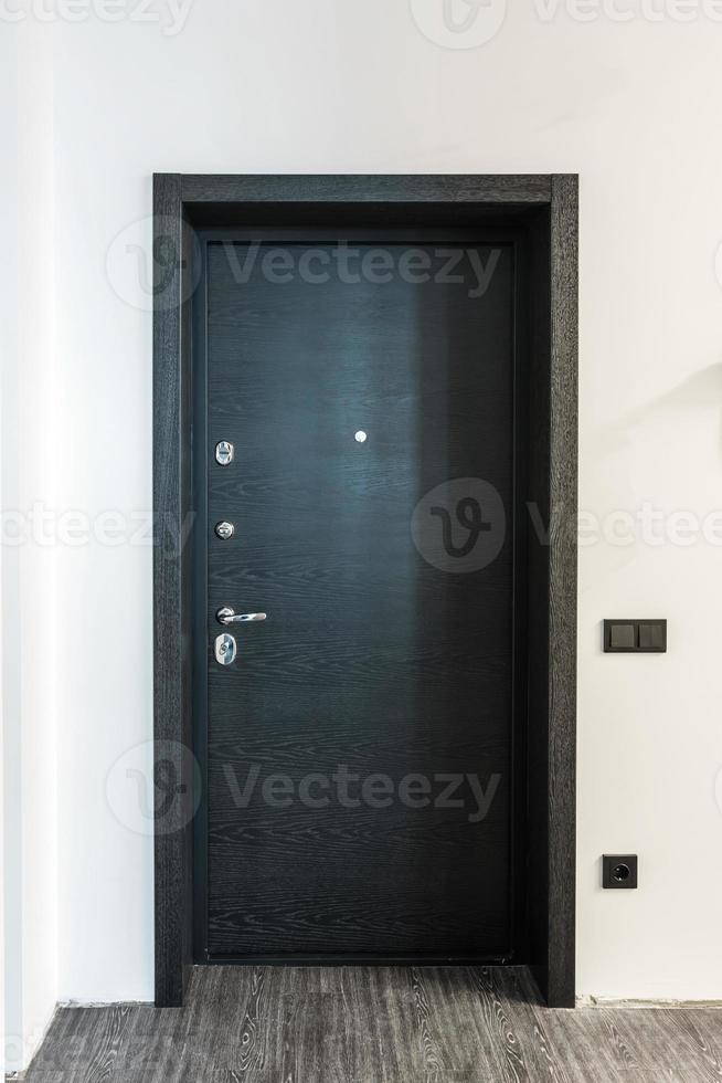 black wooden door in dark style color for modern interior and apartments flat or office photo
