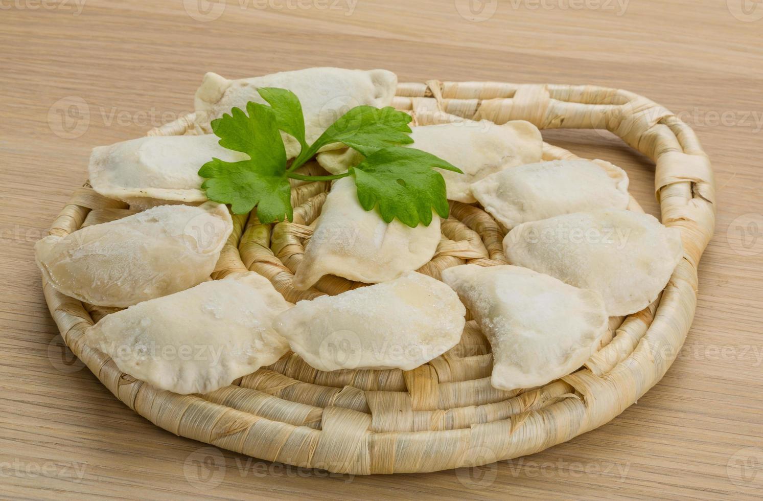 Ukrainian vareniki on wooden background 10934633 Stock Photo at Vecteezy