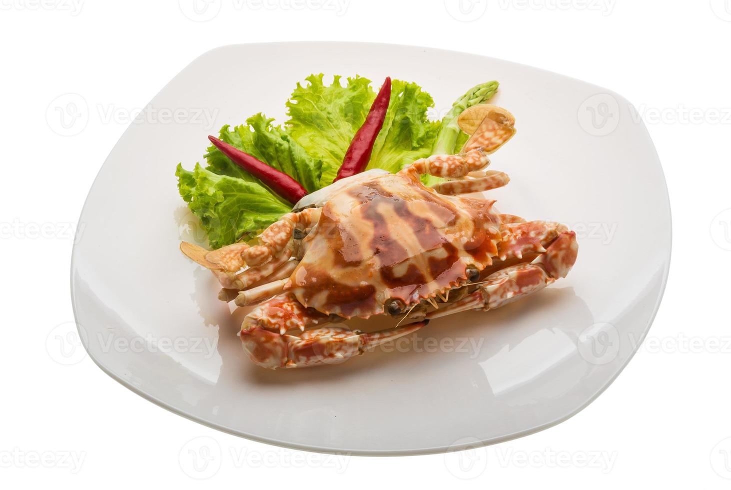 Red crab on the plate and white background photo