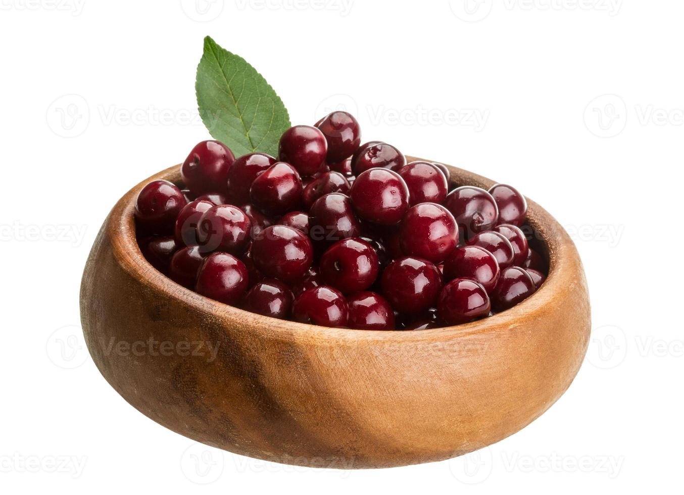 Cherry in the bowl on white background photo