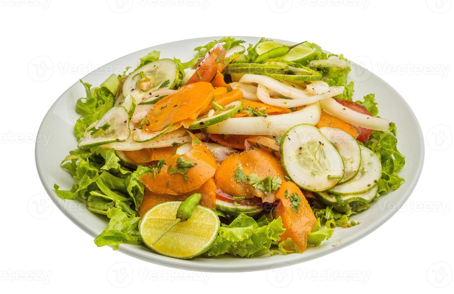 Cucumber salad on the plate and white background photo