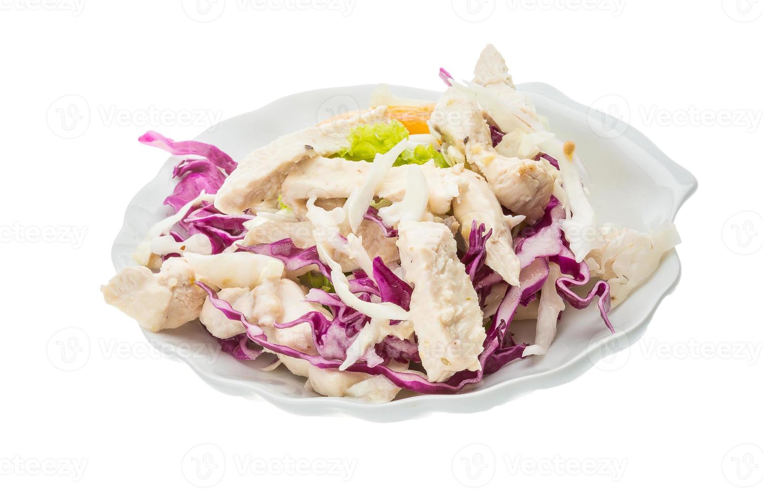 Chicken salad in a bowl on white background photo
