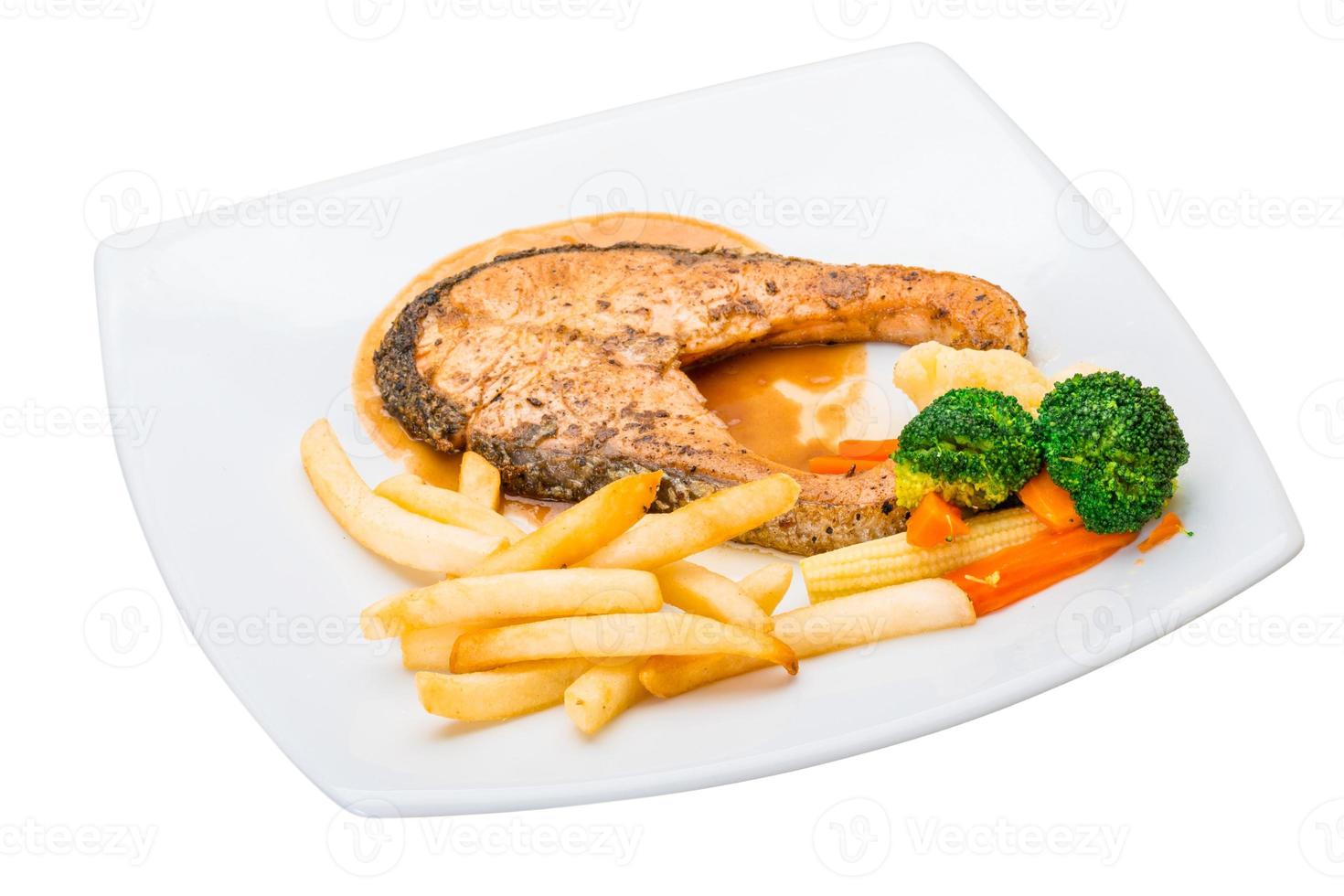 Salmon steak on the plate and white background photo