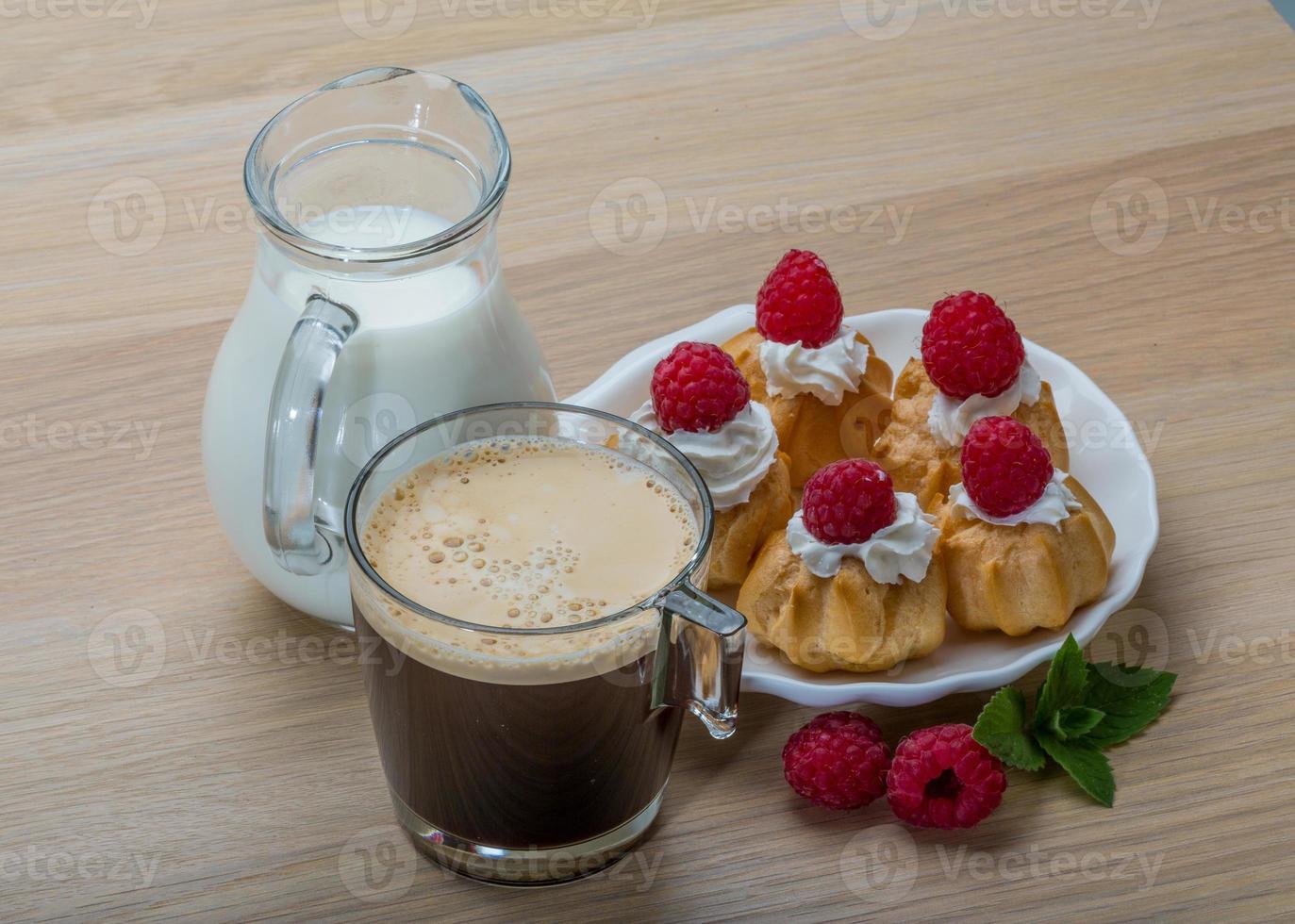 Profiterole with raspberry photo