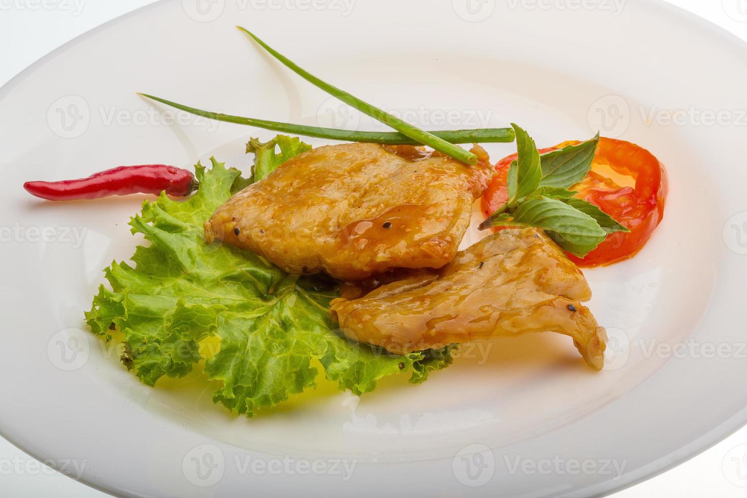 Baracuda steak on the plate and white background photo