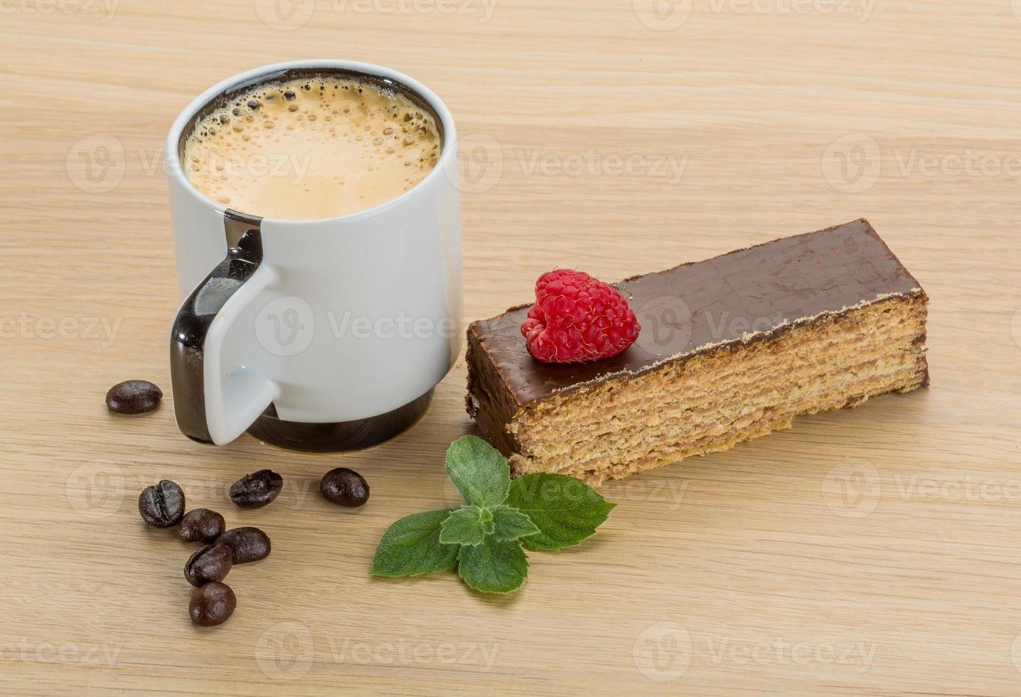 Coffee with cake on wooden background photo
