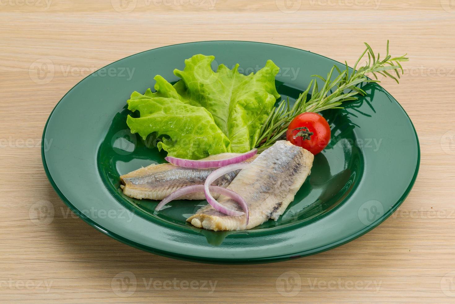 Herring fillet on the plate and wooden background 10936892 Stock Photo