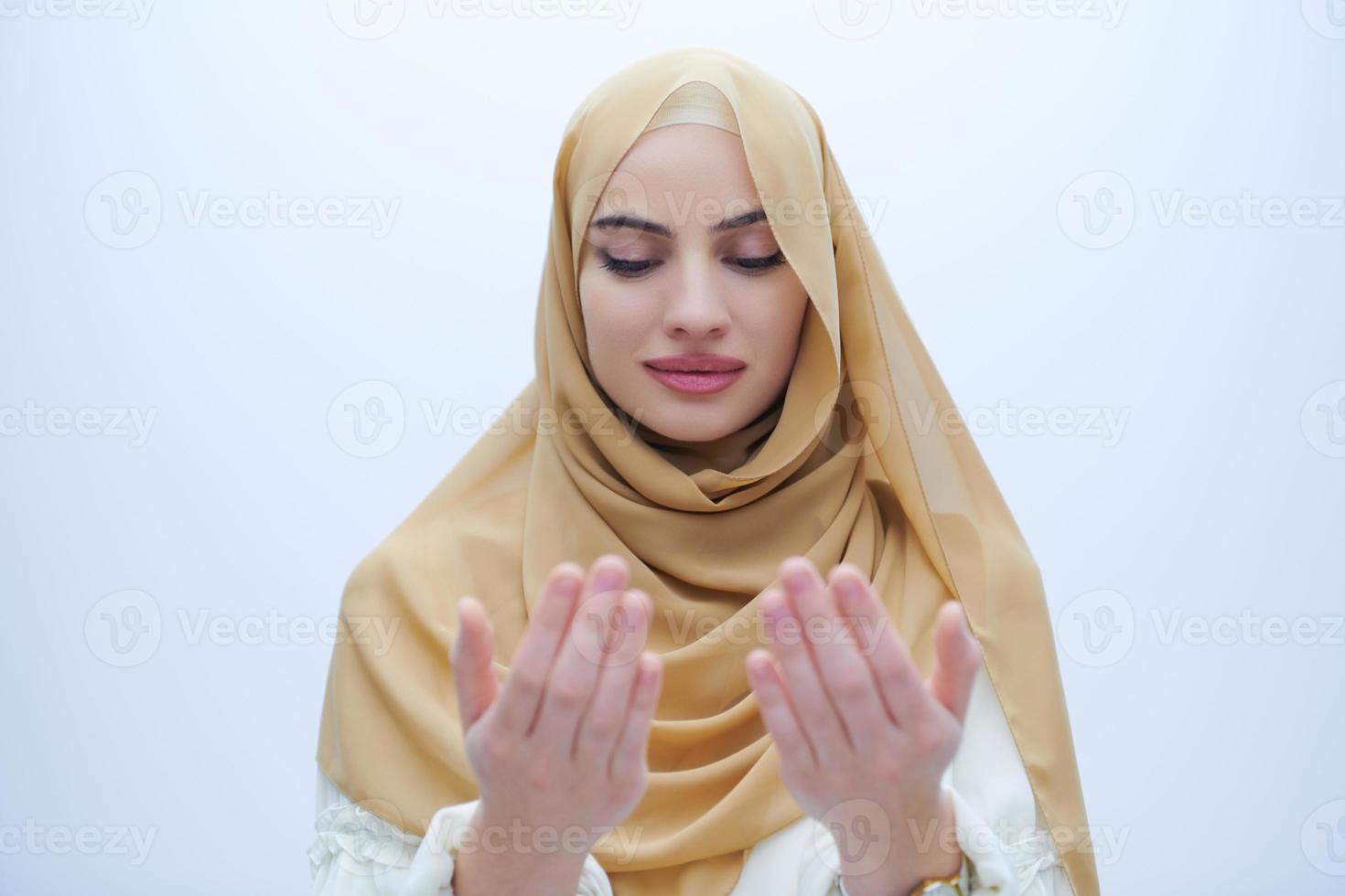 muslim woman making traditional prayer to God photo