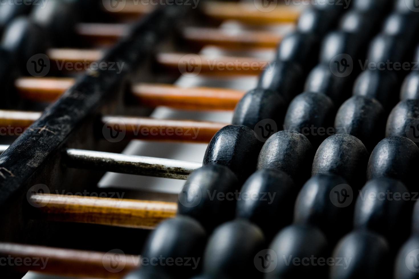 Vintage wooden abacus isolated on white photo