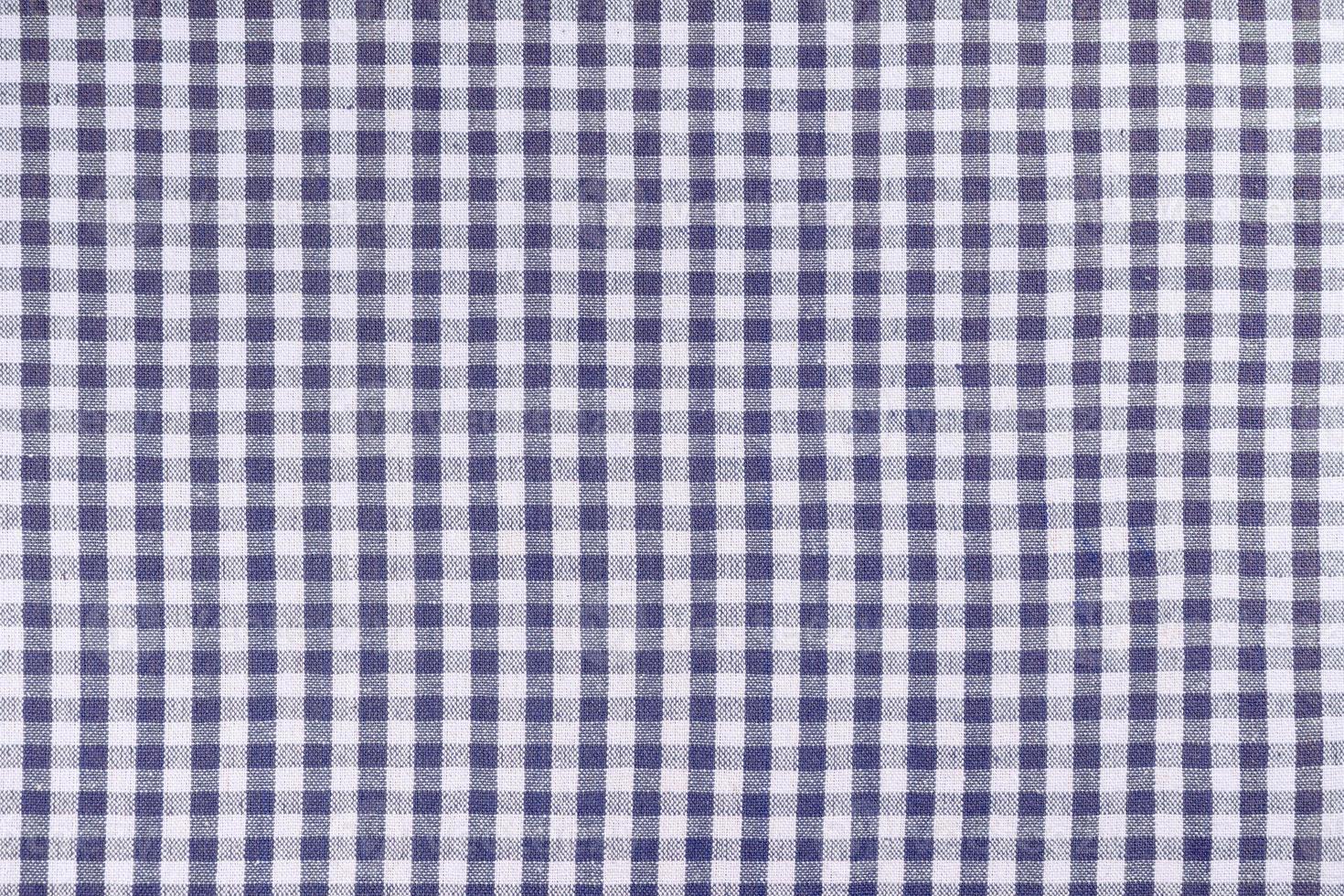 Blue classic checkered tablecloth texture, background with copy space. photo