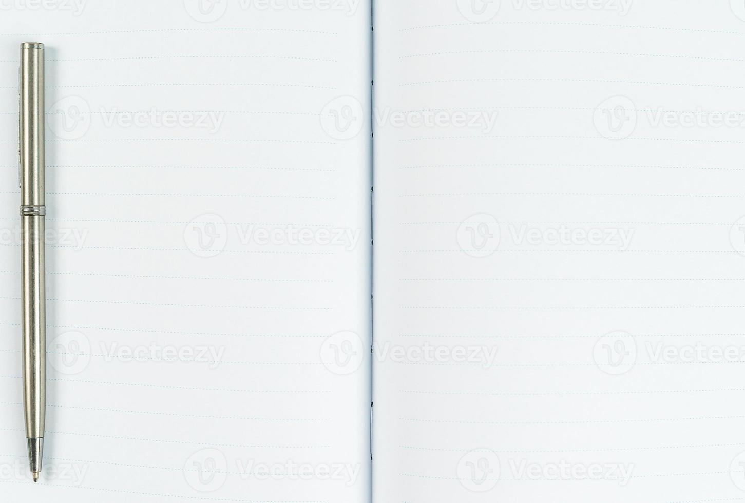 Blank notebook diary with silver pen photo