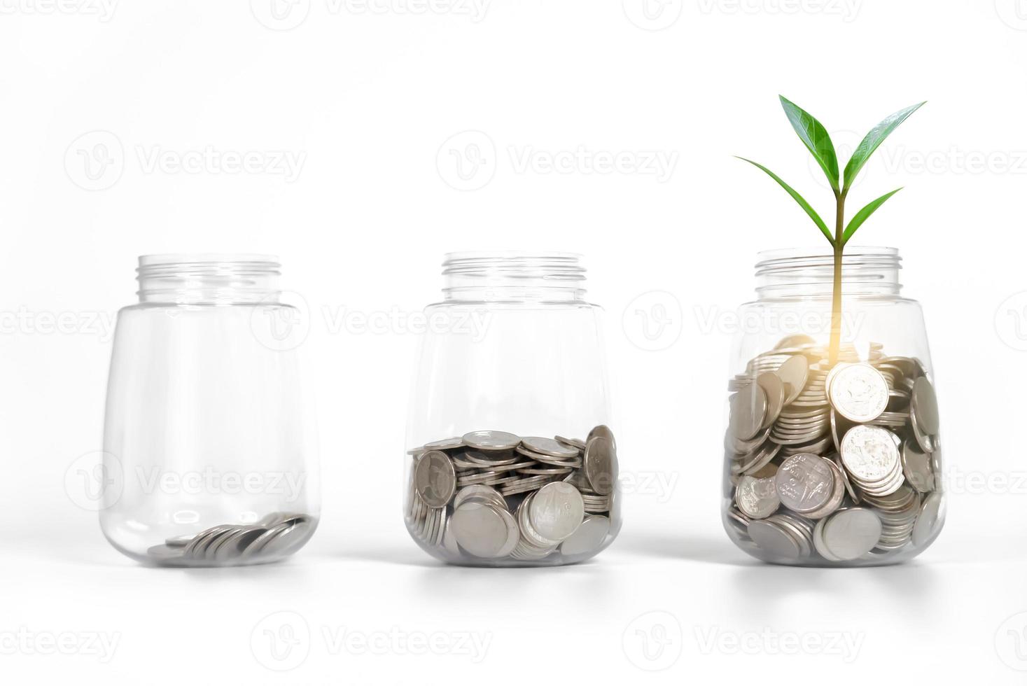 Saving money in jars and plant represent the growing more amount. photo