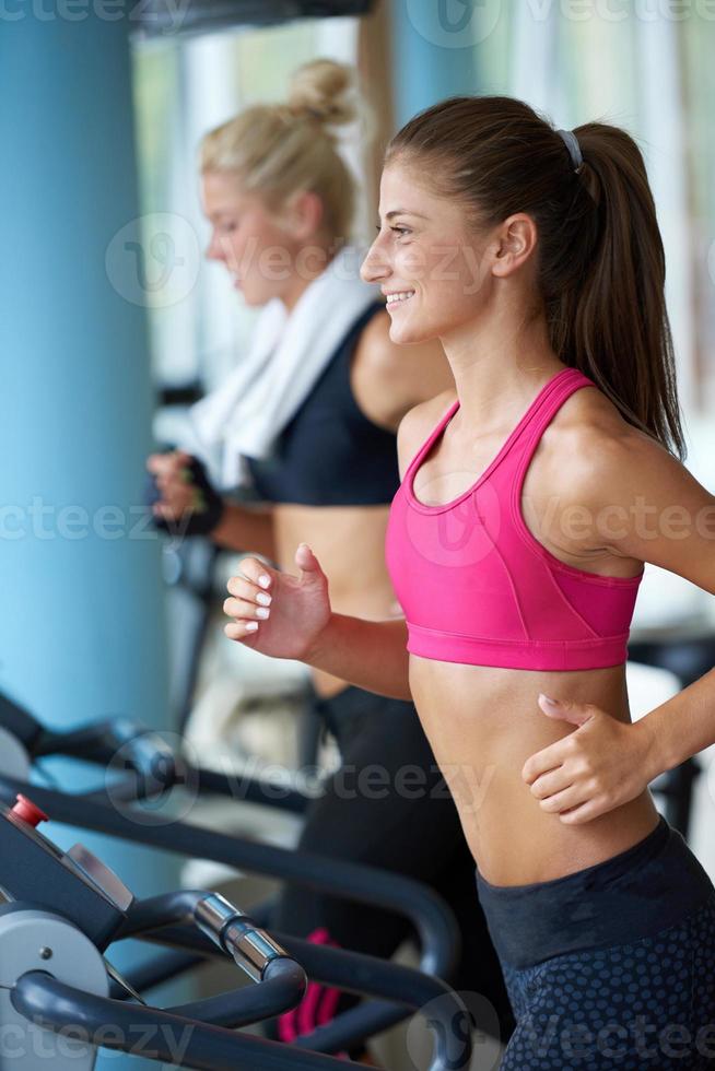 woman exercising on treadmill in gym photo