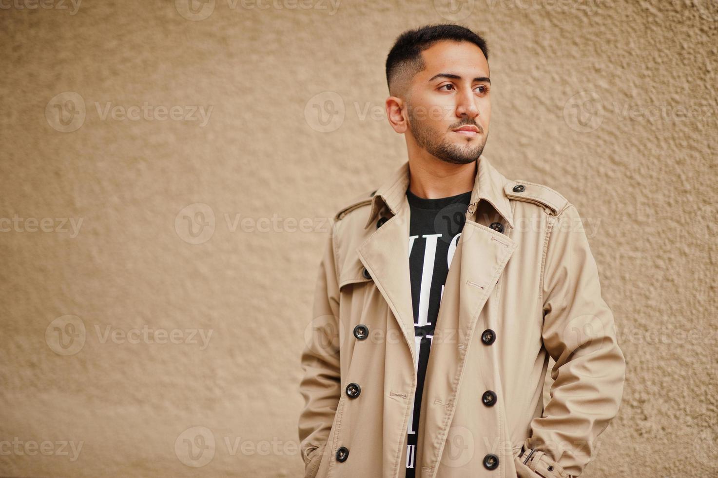 Stylish kuwaiti man at trench coat. photo