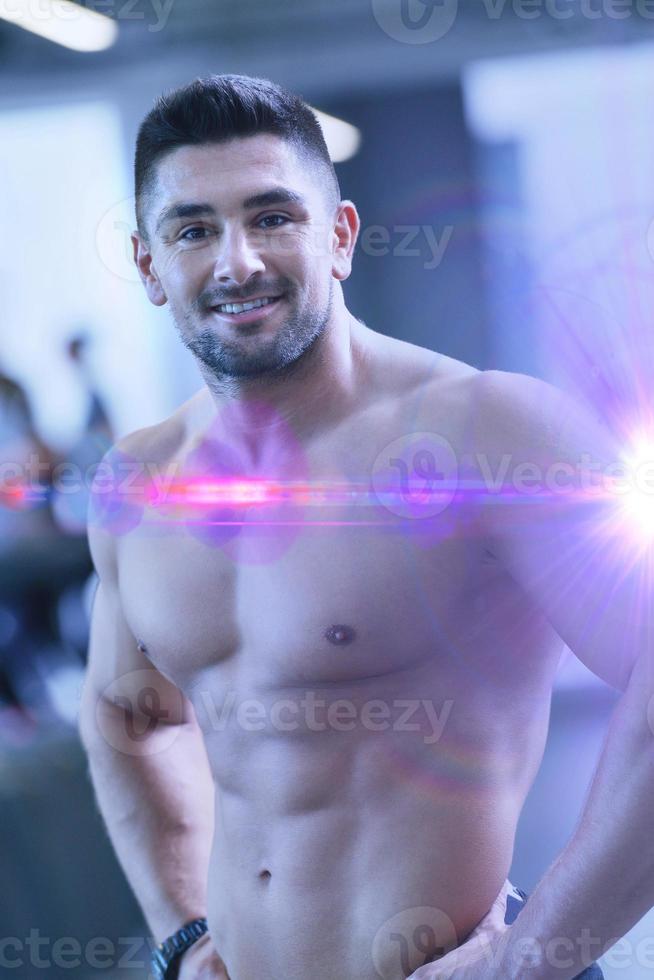 handsome man exercising at the gym photo