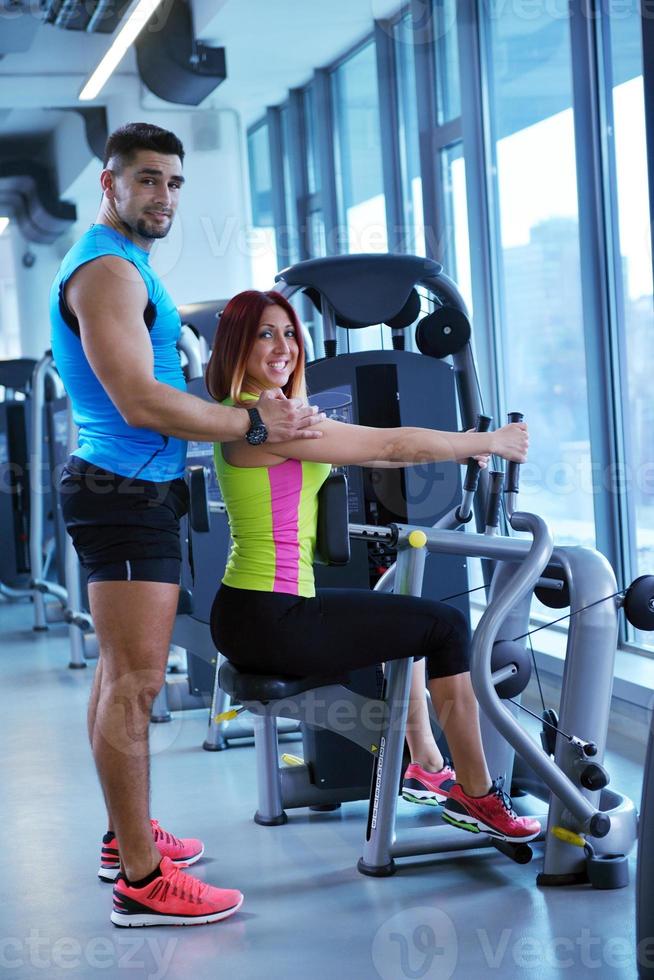 woman exercising with her personal trainer photo