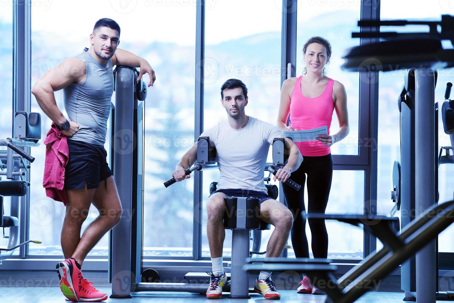 woman exercising with her personal trainer photo