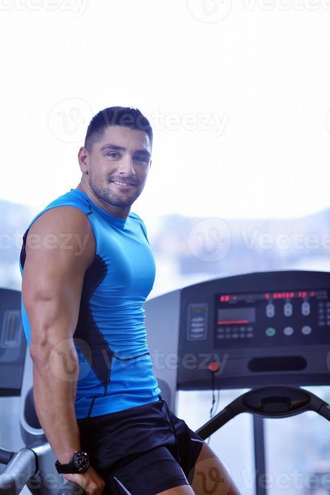 man running on the treadmill photo