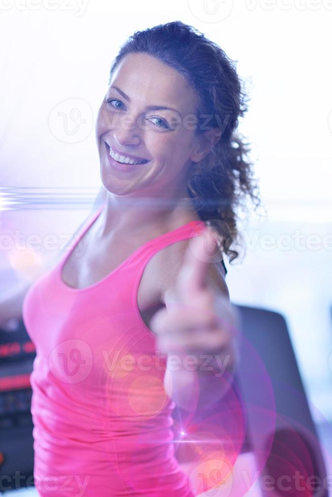 woman exercising on treadmill in gym photo